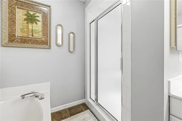 a living room with furniture and a gym machine