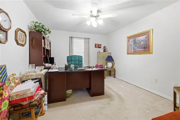 a bedroom with furniture and a chandelier