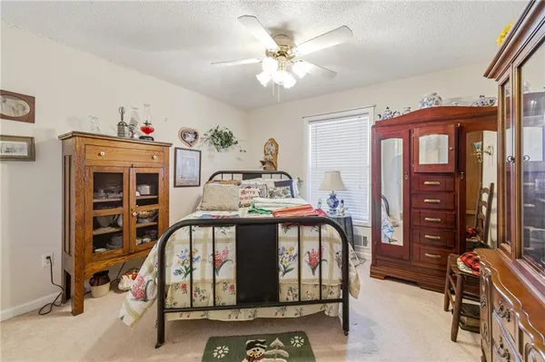 a view of a livingroom with furniture and a flat screen tv