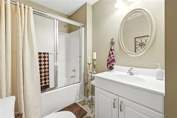 a view of a chairs and table on the wooden deck