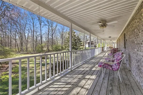 a view of a house with a yard patio and a fountain