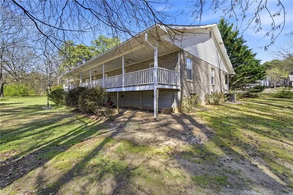 a view of a house with a big yard