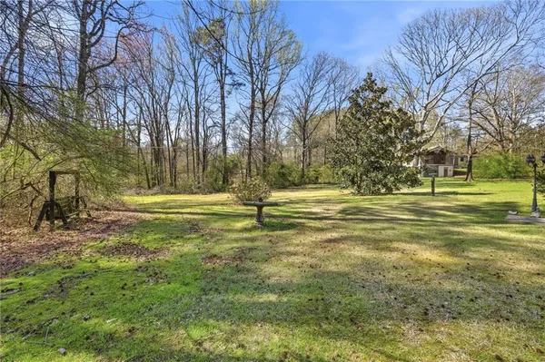 a big yard with large trees