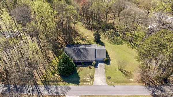 a view of swimming pool with a yard and sitting area