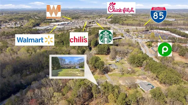 an aerial view of a houses with a lake view
