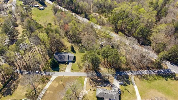 an aerial view of residential houses with outdoor space