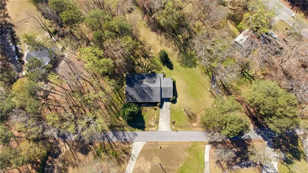 a view of a yard with a tree