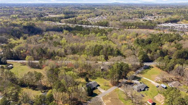 an aerial view of house with yard and mountain view