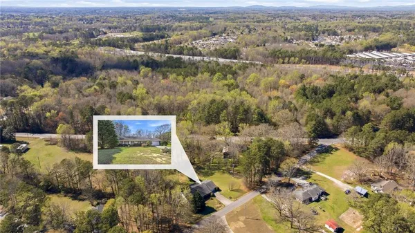 an aerial view of residential house and parking space