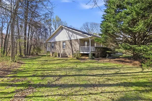 a front view of a house with a yard table and chairs
