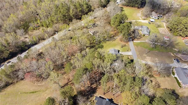 an aerial view of residential house with parking space
