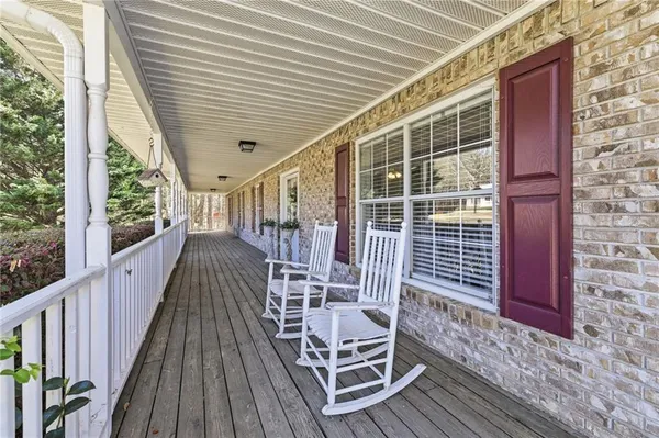 a view of a balcony with chairs