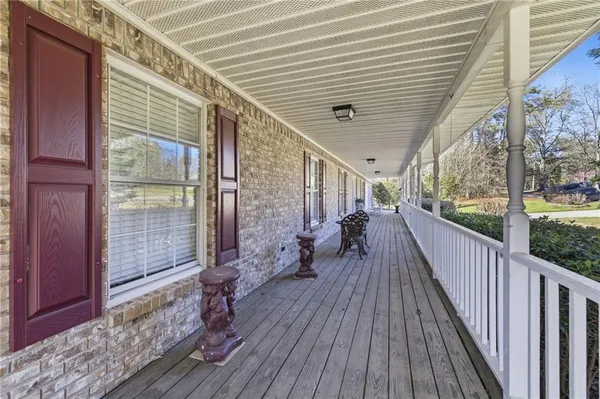 a view of a balcony with wooden floor