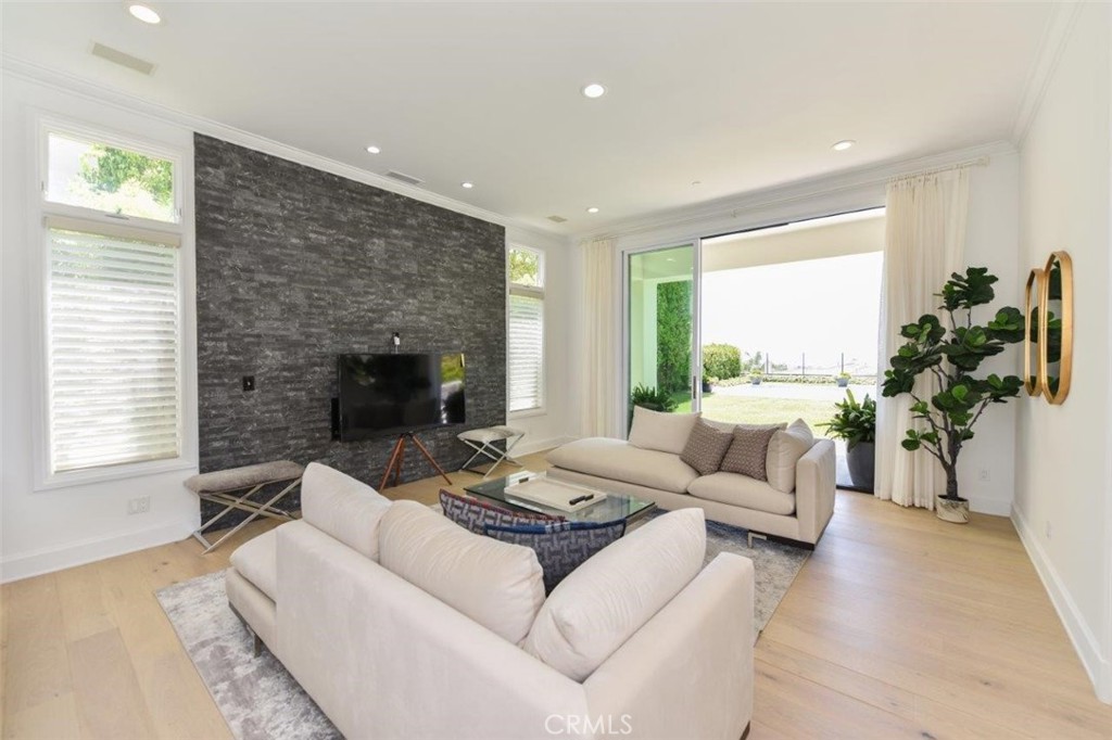 7 Via Brezza Newport Coast, CA 92657 - Photo 13 of 74 a living room with furniture and a fireplace