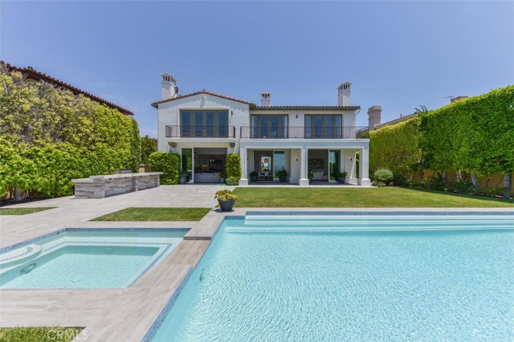 7 Via Brezza Newport Coast, CA 92657 - Photo 3 of 74 a view of an house with swimming pool and yard