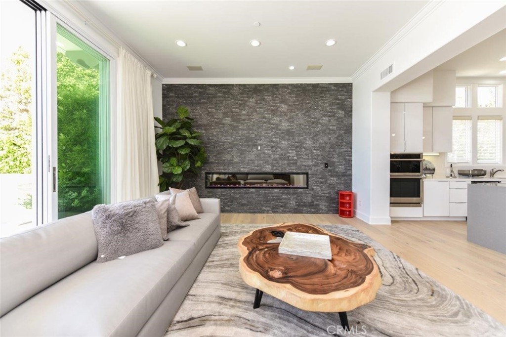 7 Via Brezza Newport Coast, CA 92657 - Photo 34 of 74 a living room with furniture and a fireplace