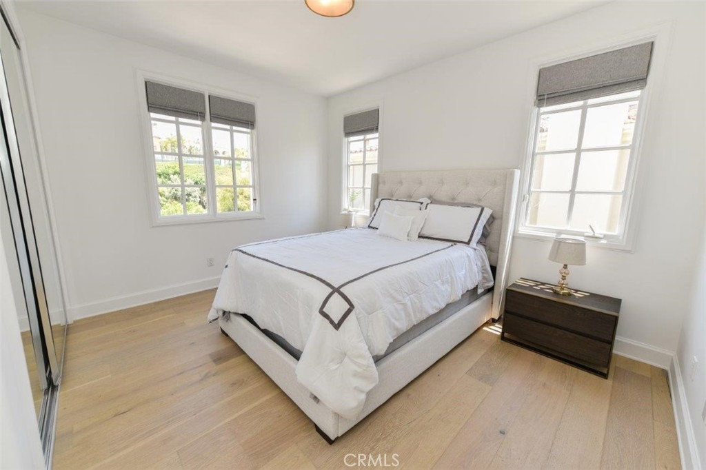 7 Via Brezza Newport Coast, CA 92657 - Photo 41 of 74 a bed sitting in a bedroom next to a window