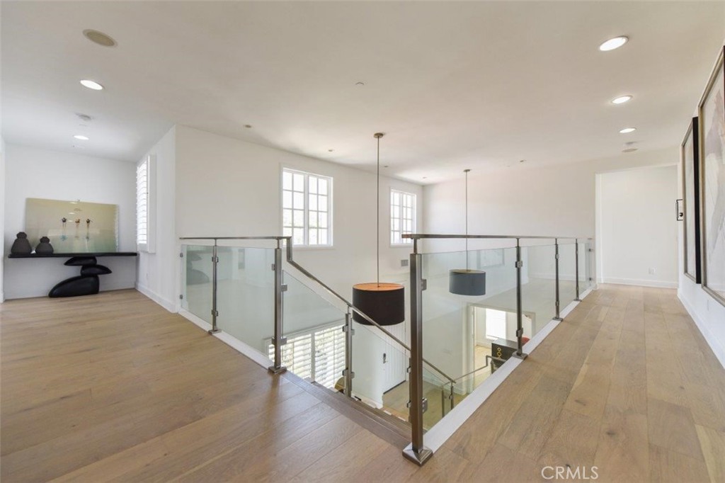 7 Via Brezza Newport Coast, CA 92657 - Photo 46 of 74 a view of a kitchen with white cabinets and stainless steel appliances