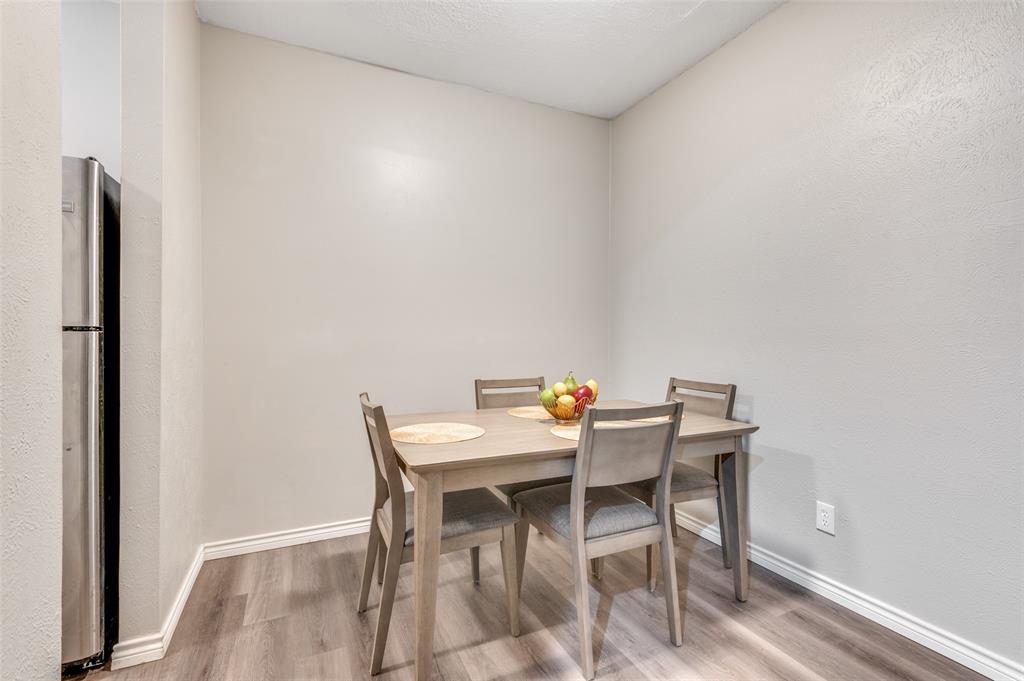 2110 Randy Snow Road, Unit 313 Arlington, TX 76011 - Photo 13 of 25 a view of a dining room with furniture and wooden floor