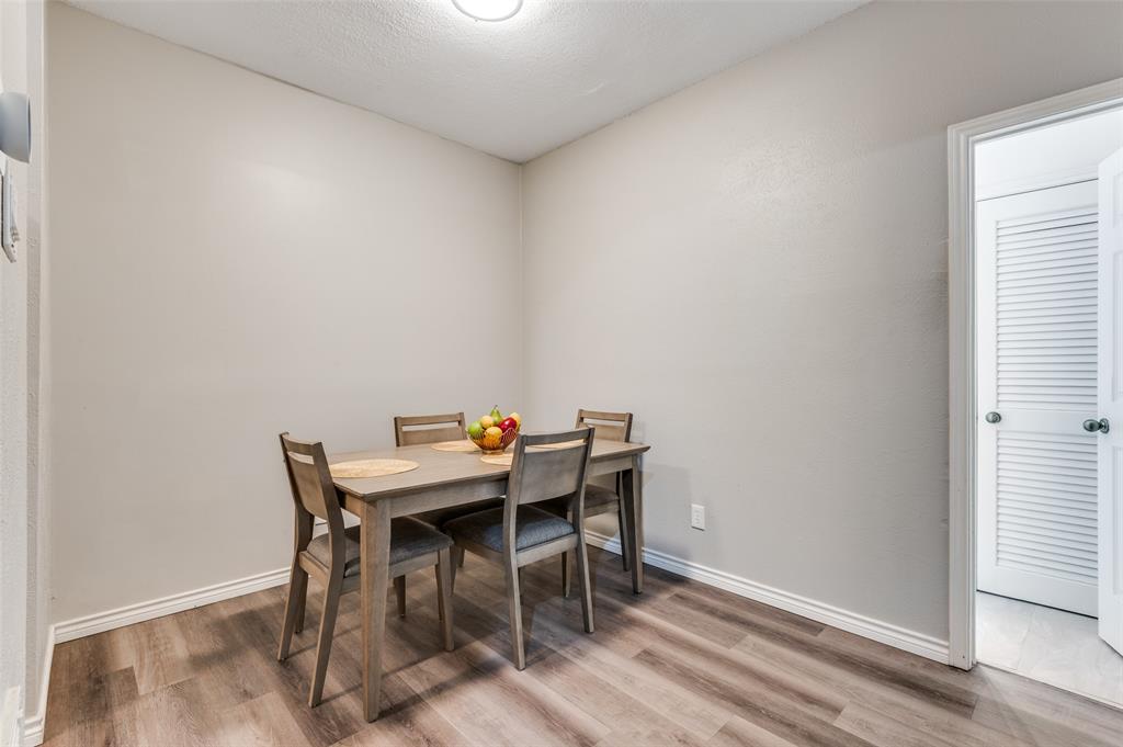 2110 Randy Snow Road, Unit 313 Arlington, TX 76011 - Photo 15 of 25 a view of a workspace with furniture and wooden floor