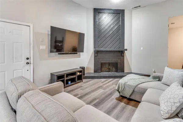 a bedroom with a bed and a fireplace