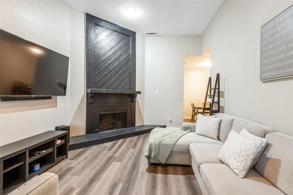 2110 Randy Snow Road, Unit 313 Arlington, TX 76011 - Photo 3 of 25 a bedroom with a bed and a flat screen tv