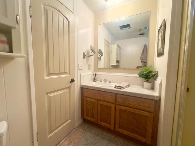 a bathroom with a double vanity sink and mirror