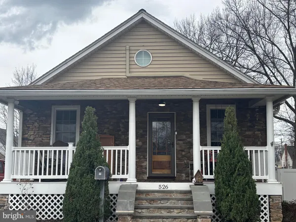 a front view of a house with a porch