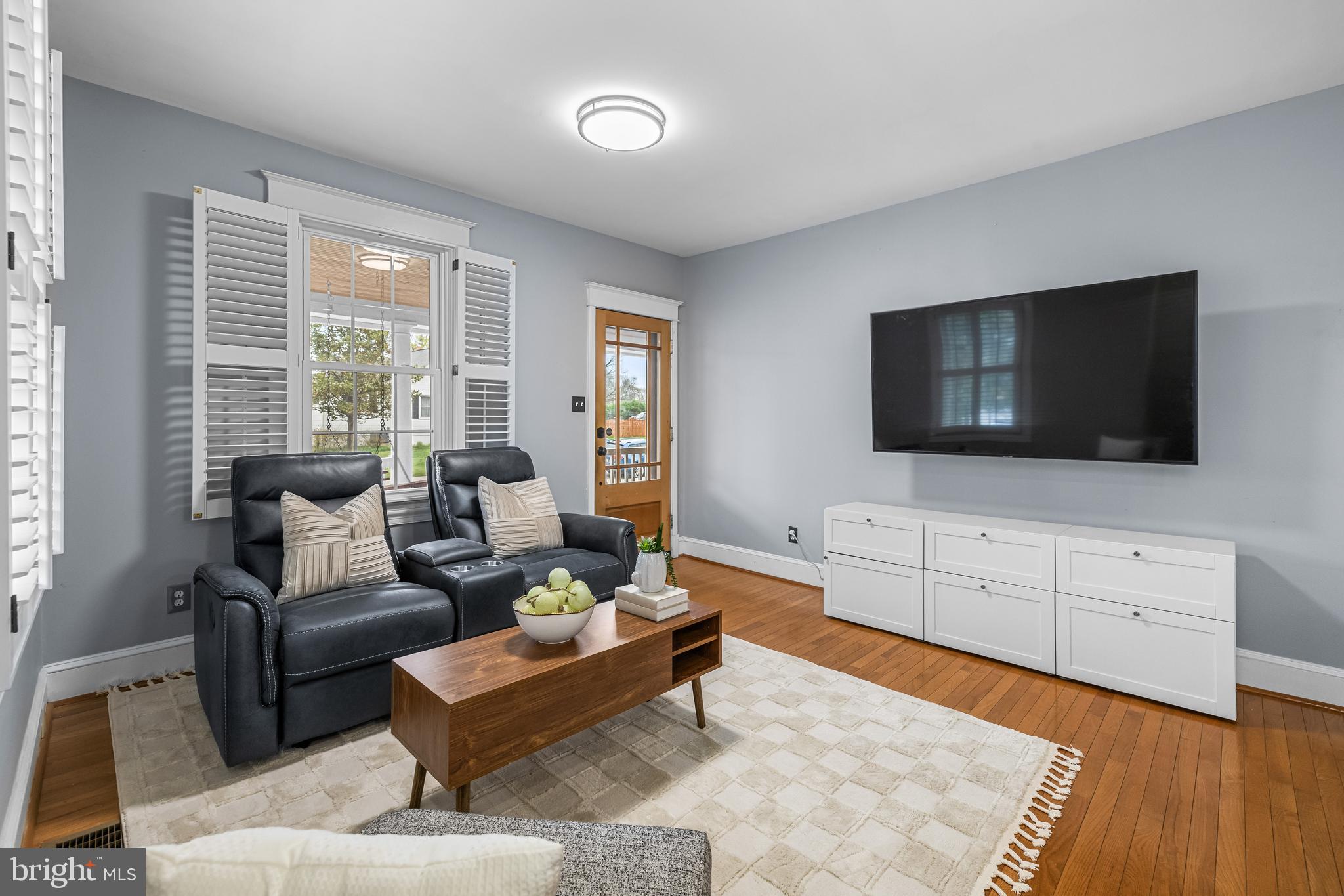 526 Hawthorne Road Linthicum Heights, MD 21090 - Photo 20 of 50 a living room with furniture and a flat screen tv