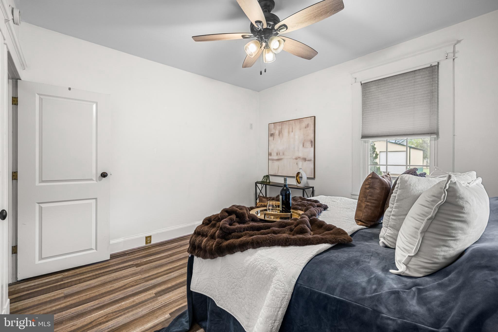 526 Hawthorne Road Linthicum Heights, MD 21090 - Photo 23 of 50 a bedroom with a bed and wooden floor