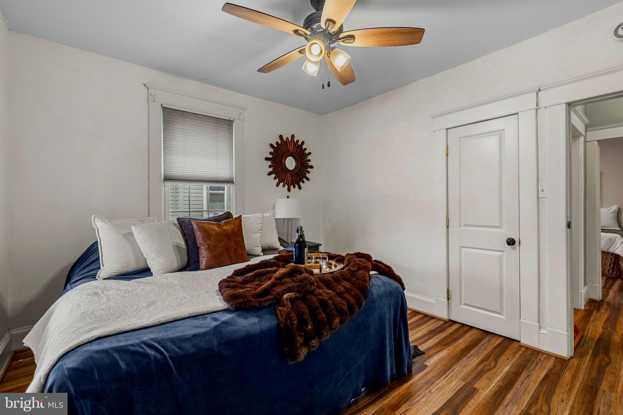 526 Hawthorne Road Linthicum Heights, MD 21090 - Photo 24 of 50 a bed room with a bed and a chandelier