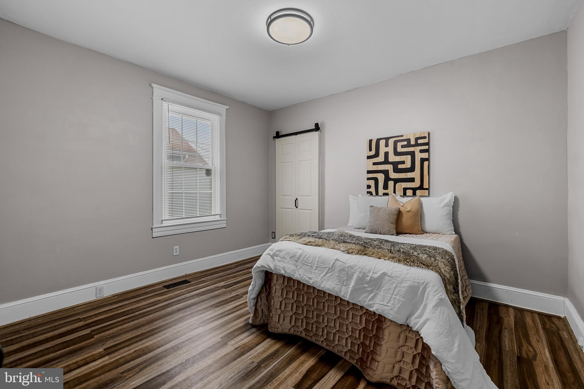 526 Hawthorne Road Linthicum Heights, MD 21090 - Photo 26 of 50 a bedroom with a bed and a window