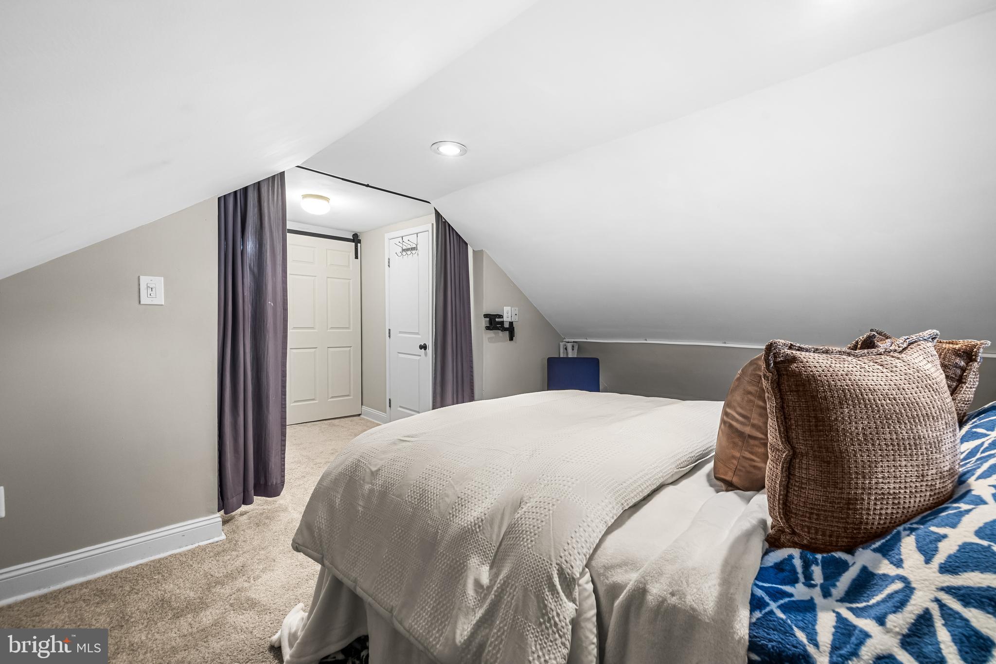 526 Hawthorne Road Linthicum Heights, MD 21090 - Photo 37 of 50 a bed sitting in a bedroom and chair