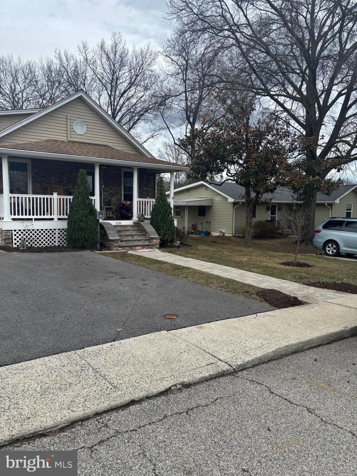 526 Hawthorne Road Linthicum Heights, MD 21090 - Photo 4 of 4 a front view of a house with a yard and garage