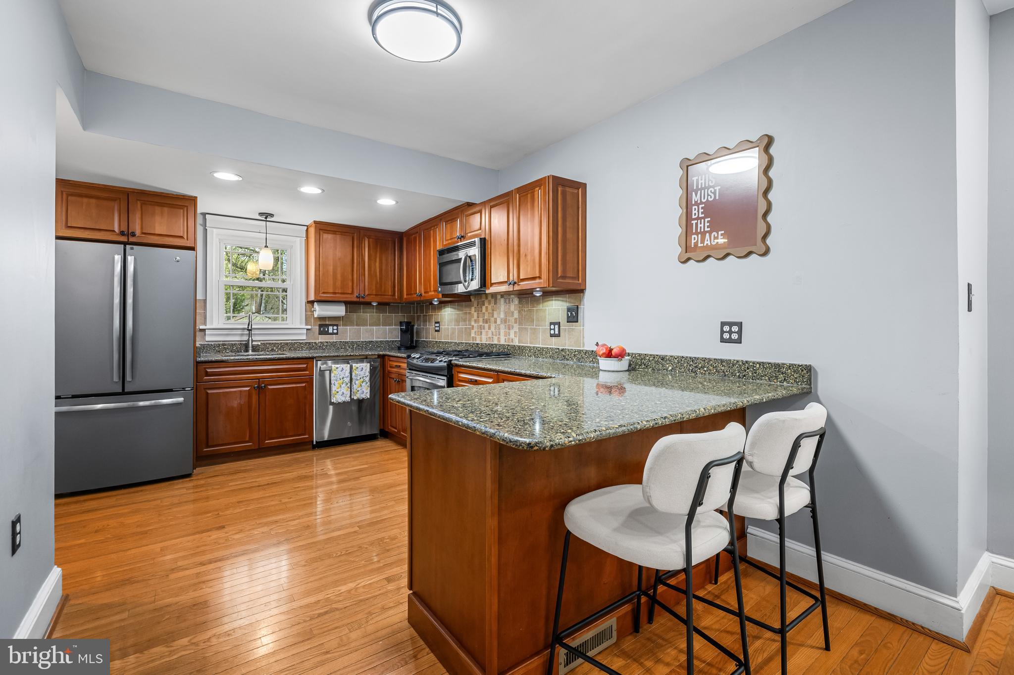 526 Hawthorne Road Linthicum Heights, MD 21090 - Photo 8 of 50 a kitchen with stainless steel appliances granite countertop a stove refrigerator sink and microwave