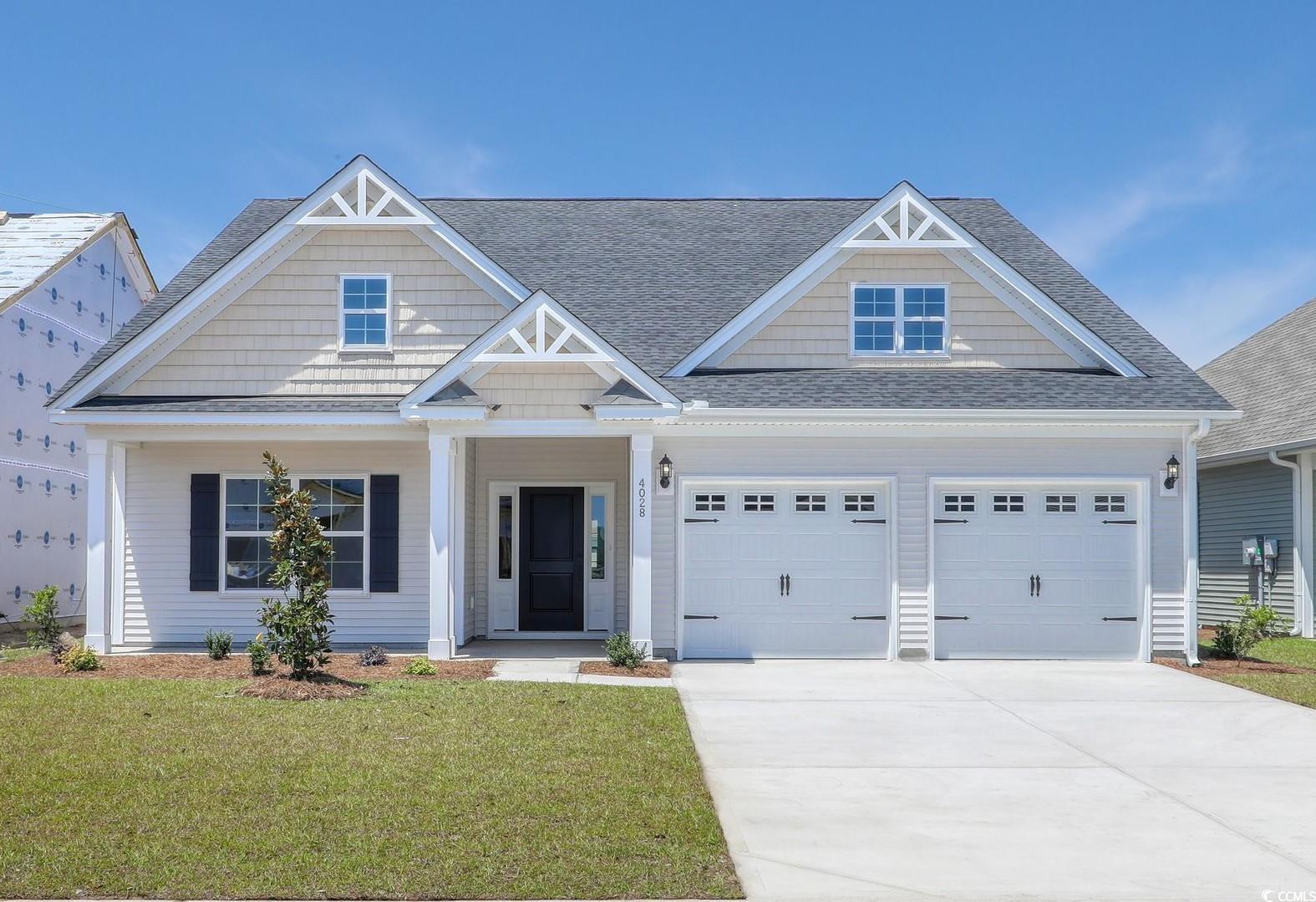 4028 Bucolic Loop Myrtle Beach, SC 29588 - Photo 1 of 40 View of front of house featuring a shingled roof,