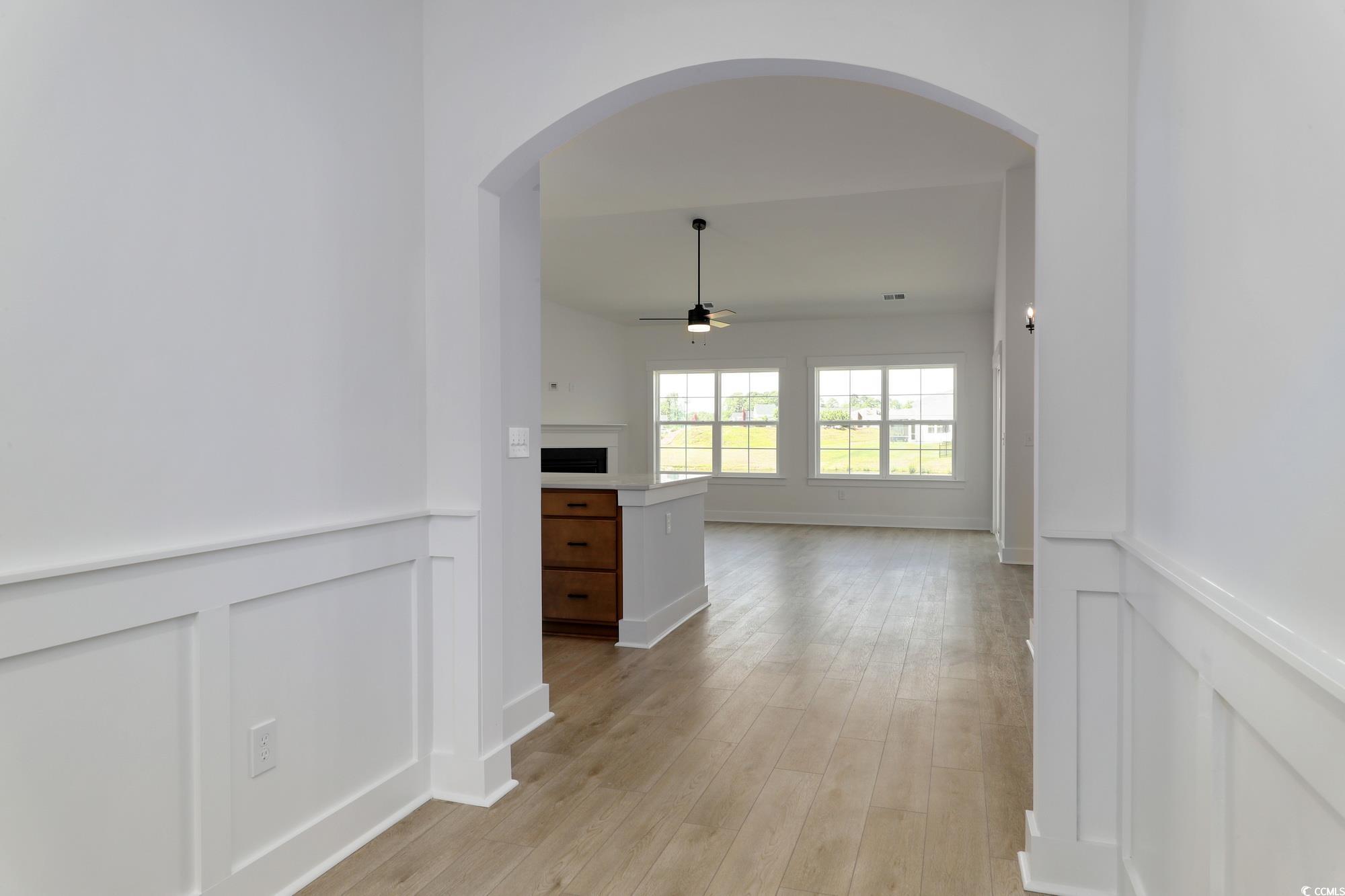 4028 Bucolic Loop Myrtle Beach, SC 29588 - Photo 13 of 40 Hall featuring arched walkways, a decorative wall,