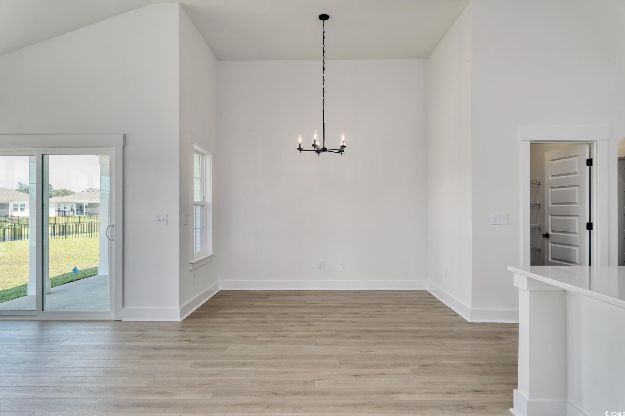 4028 Bucolic Loop Myrtle Beach, SC 29588 - Photo 17 of 40 Unfurnished dining area with a chandelier, light w