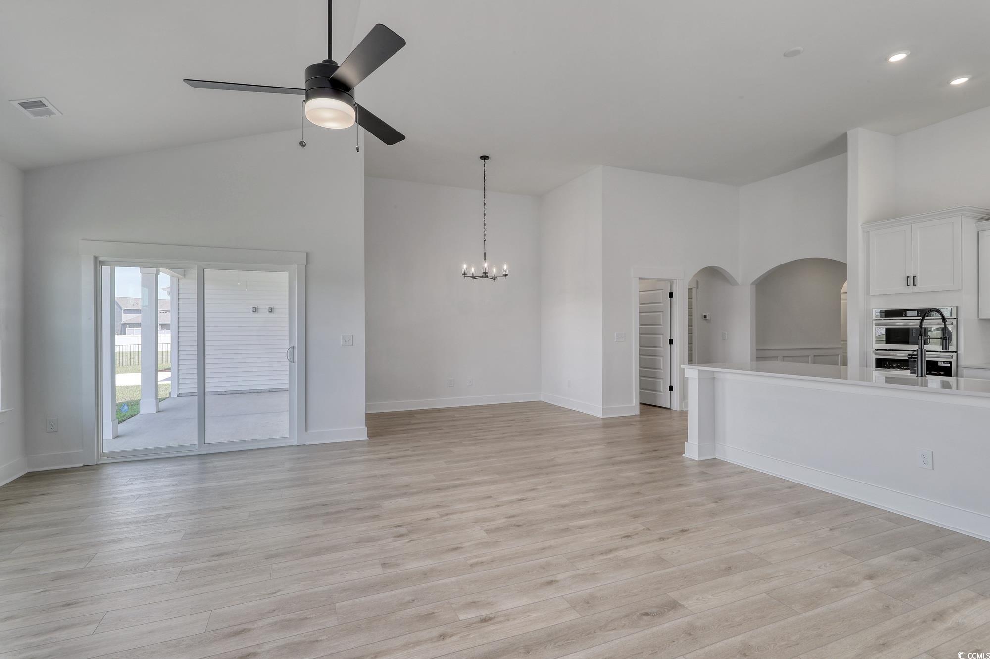 4028 Bucolic Loop Myrtle Beach, SC 29588 - Photo 18 of 40 Unfurnished living room featuring ceiling fan, lig