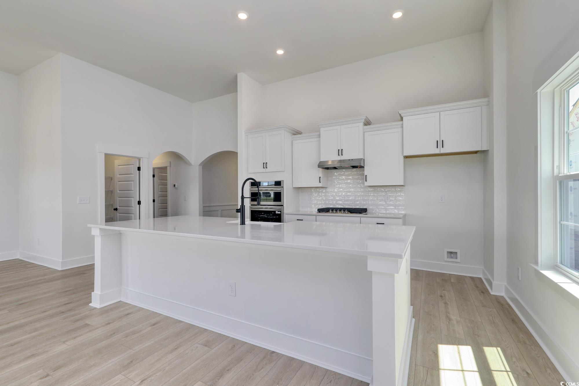 4028 Bucolic Loop Myrtle Beach, SC 29588 - Photo 19 of 40 Kitchen with gas cooktop, tasteful backsplash, a k