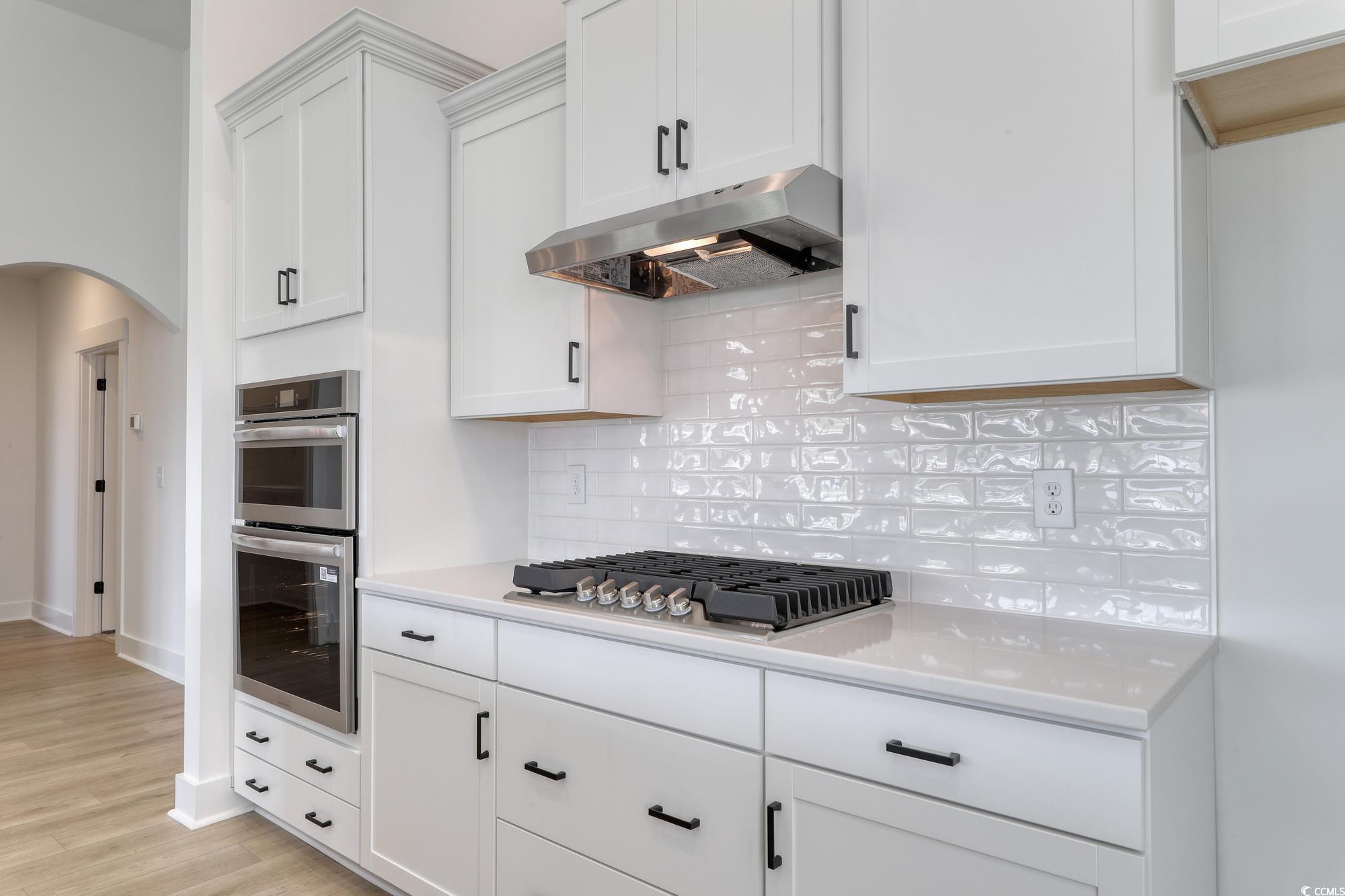 4028 Bucolic Loop Myrtle Beach, SC 29588 - Photo 20 of 40 Kitchen with under cabinet range hood, appliances