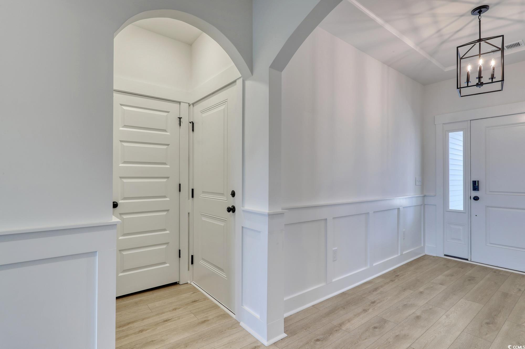 4028 Bucolic Loop Myrtle Beach, SC 29588 - Photo 4 of 40 Foyer entrance with light wood-style flooring, a c