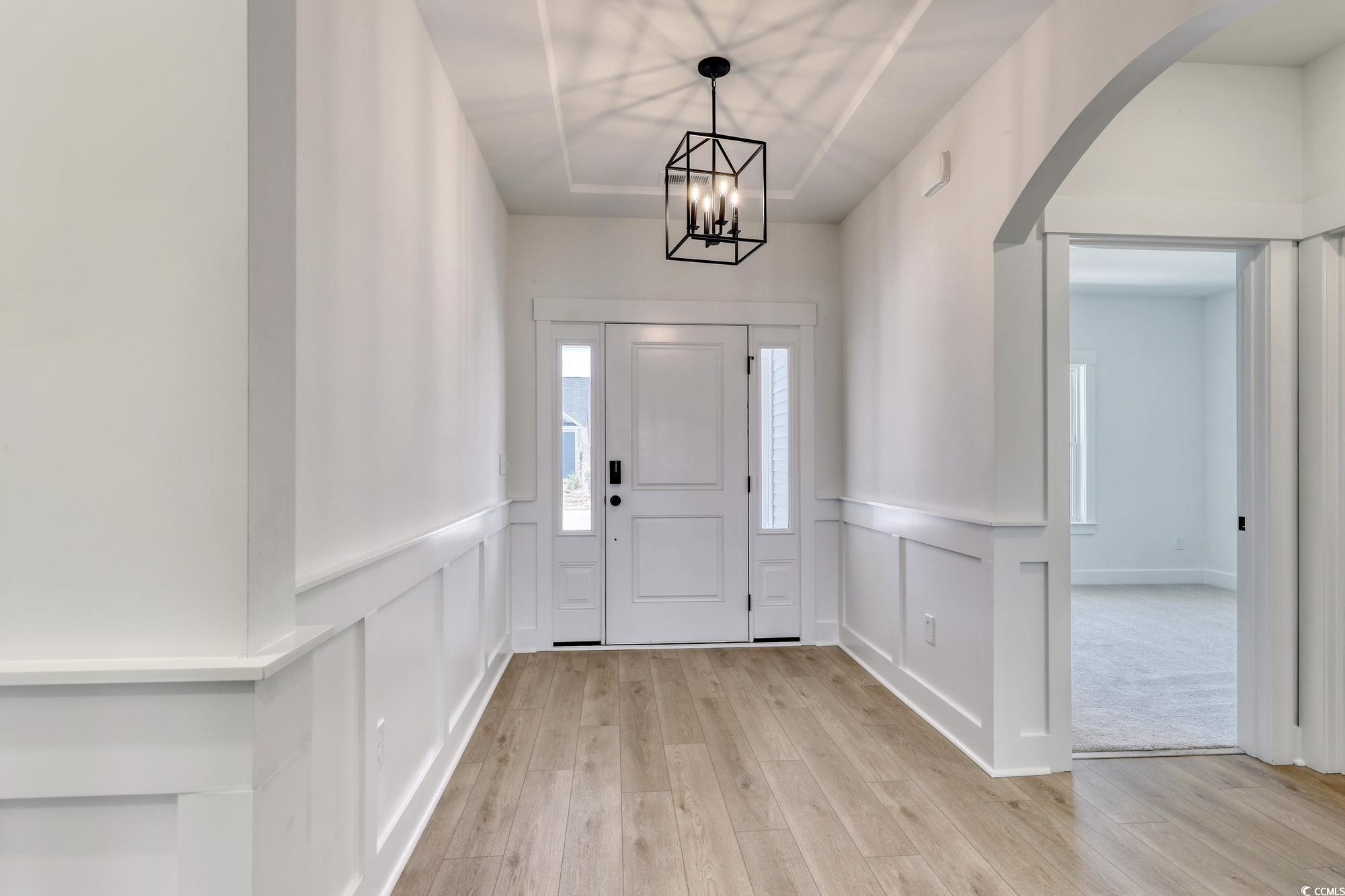 4028 Bucolic Loop Myrtle Beach, SC 29588 - Photo 5 of 40 Entrance foyer with a decorative wall, light wood-