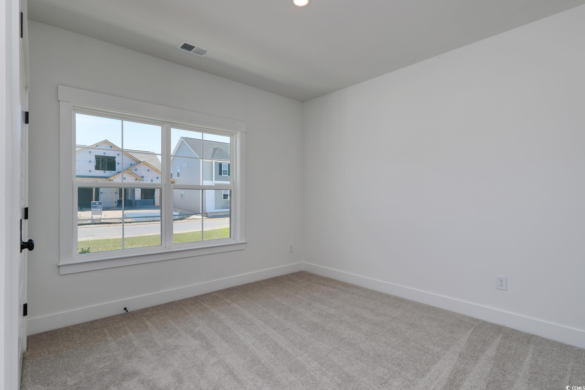4028 Bucolic Loop Myrtle Beach, SC 29588 - Photo 7 of 40 Carpeted spare room featuring healthy amount of na