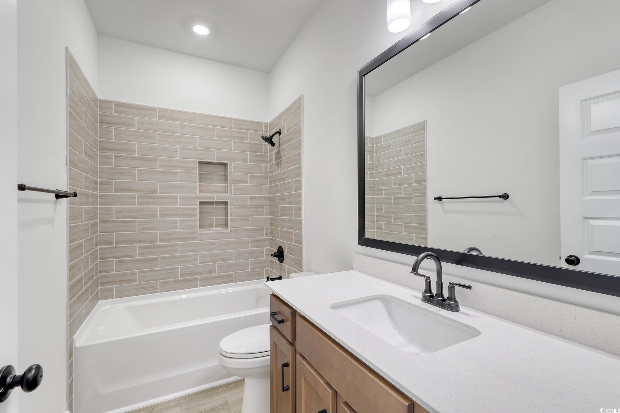 4028 Bucolic Loop Myrtle Beach, SC 29588 - Photo 9 of 40 Bathroom featuring vanity, toilet, bathing tub / s