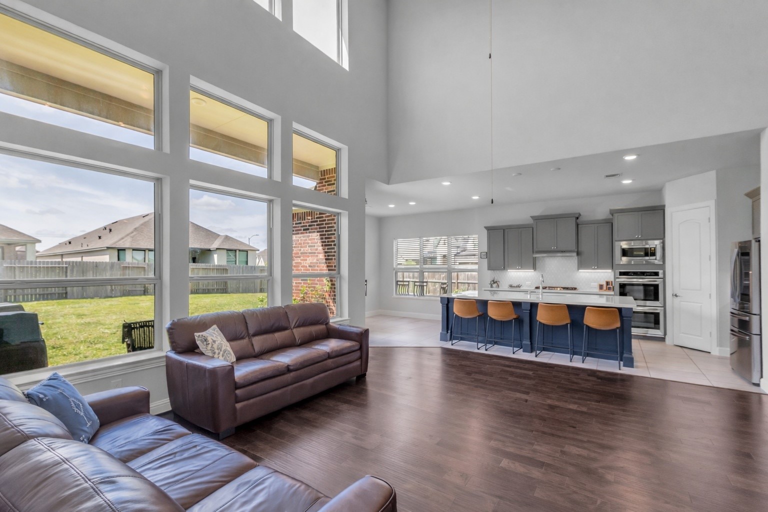 423 Round Top Street Webster, TX 77598 - Photo 14 of 49 a living room with furniture and a large window