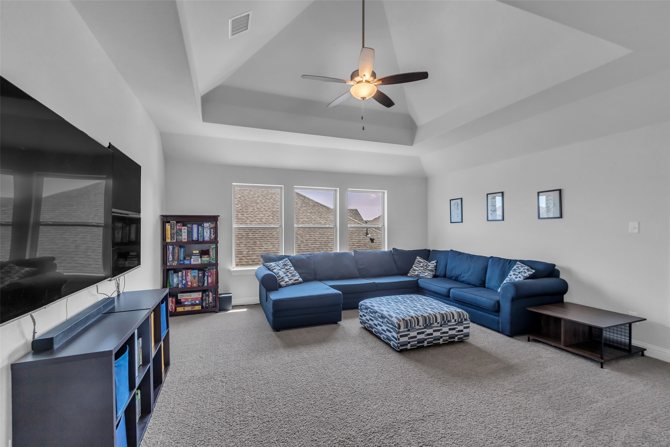 423 Round Top Street Webster, TX 77598 - Photo 29 of 49 a living room with furniture and a flat screen tv