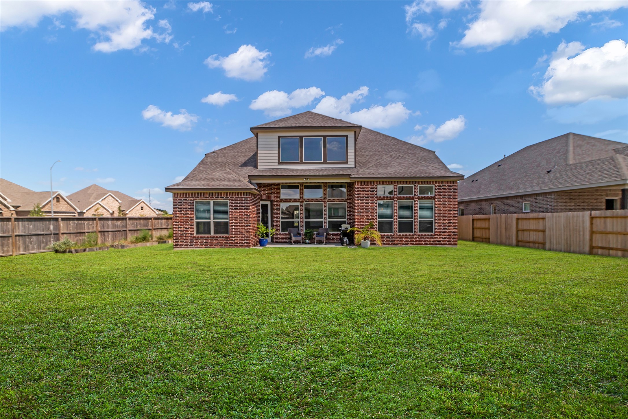 423 Round Top Street Webster, TX 77598 - Photo 41 of 49 a front view of a house with a garden