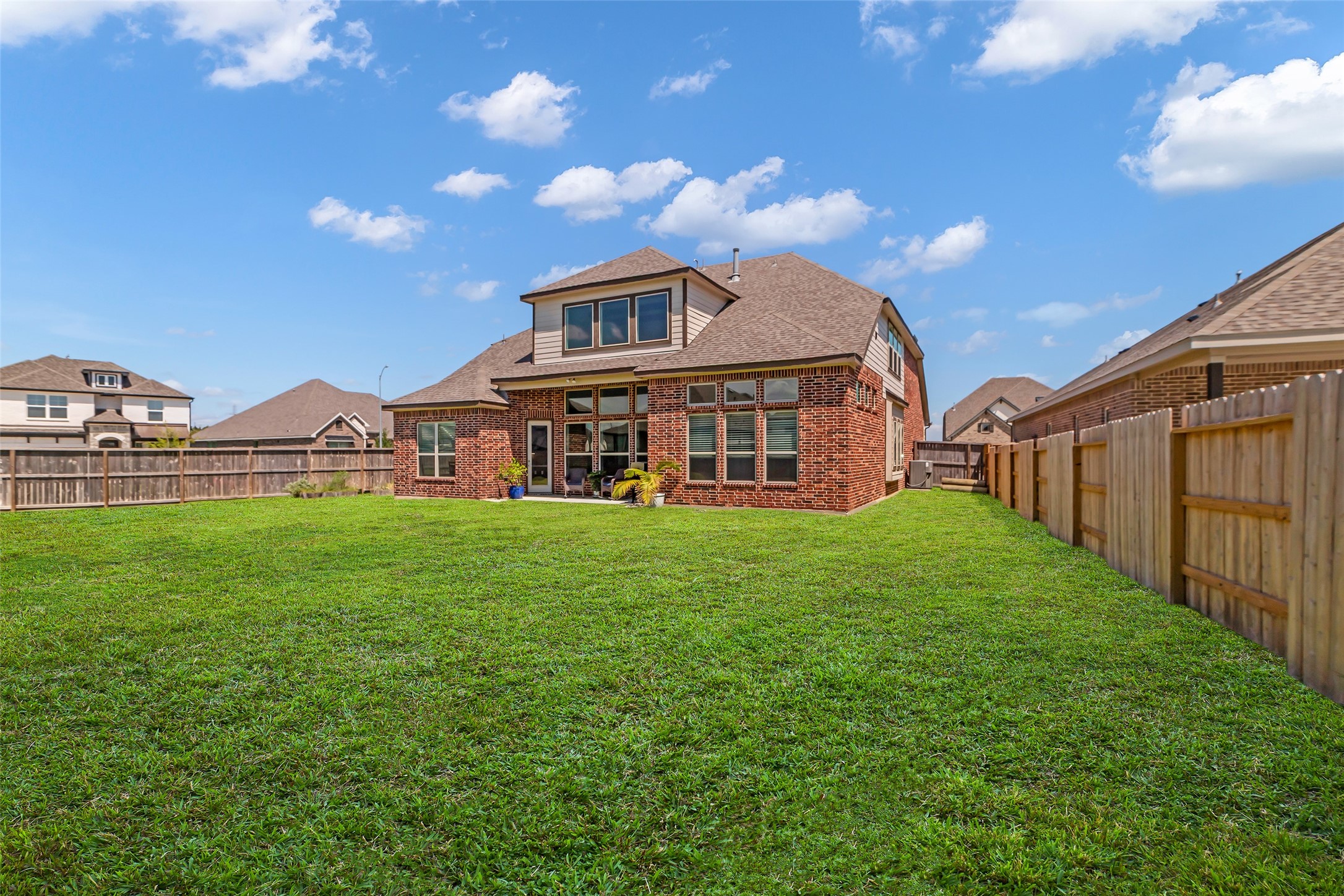 423 Round Top Street Webster, TX 77598 - Photo 42 of 49 a view of a big house with a big yard and large trees