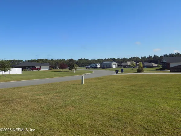 a view of a field with an outdoor space